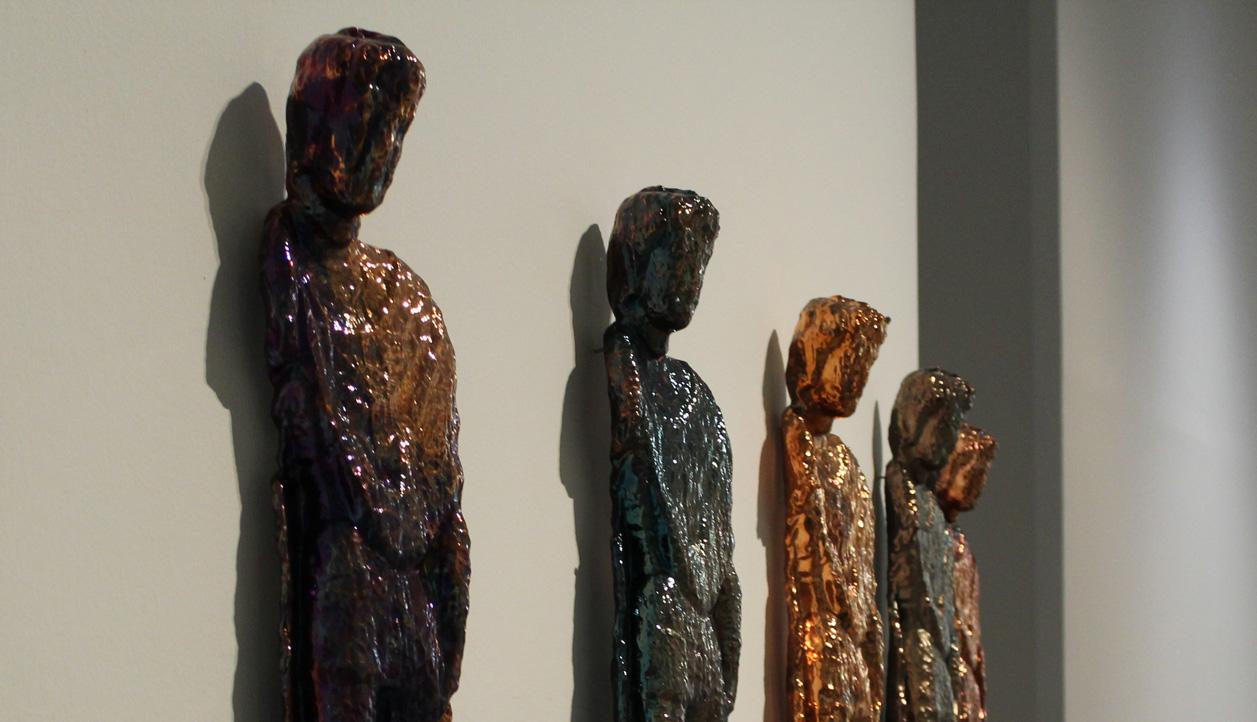 Esculturas hombres de cobre